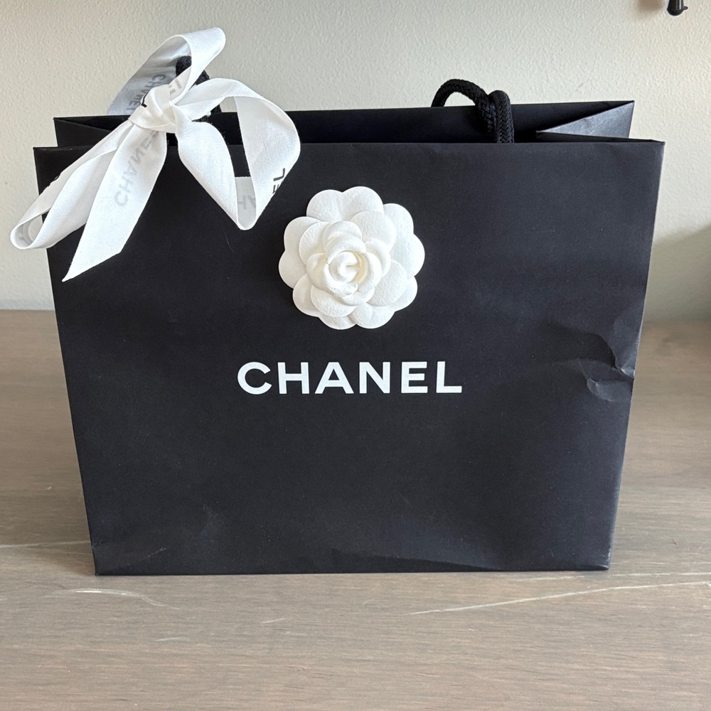 Chanel Black Bag with White Flower Accent
